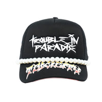 TWELVE33| TROUBLE IN PARADISE TRUCKER HAT