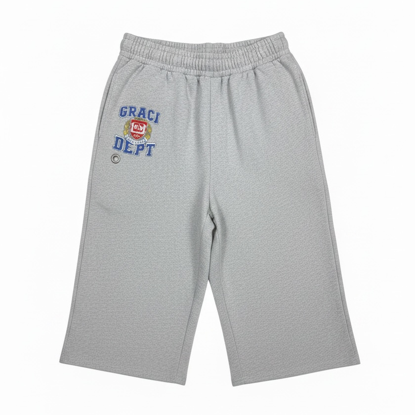Light gray heather sweatpants with an elastic waistband, featuring a colorful 'GRACI DEPT' logo patch on the left leg, displayed against a plain white background.