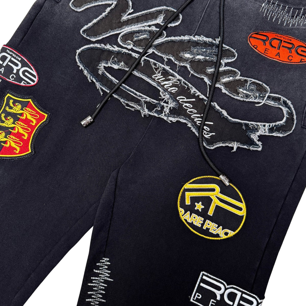 RACER PATCH JOGGER BLACK - front patch detail flat lay on white