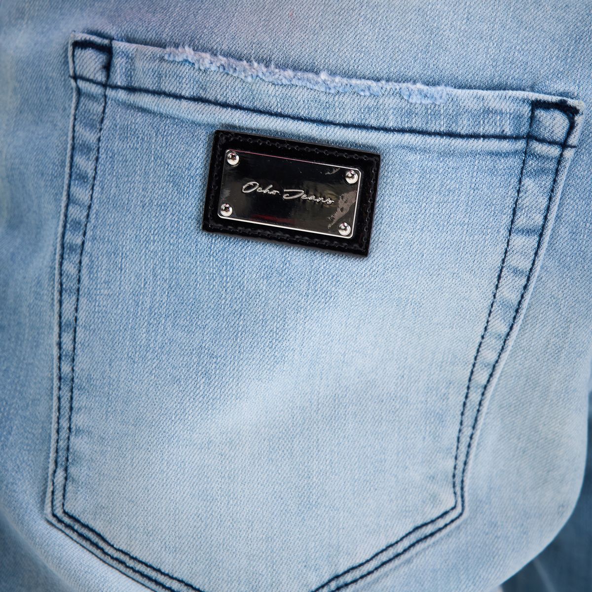 OCHO SHORE light blue jeans, engraved metal rear-pocket plate and stitching detail
