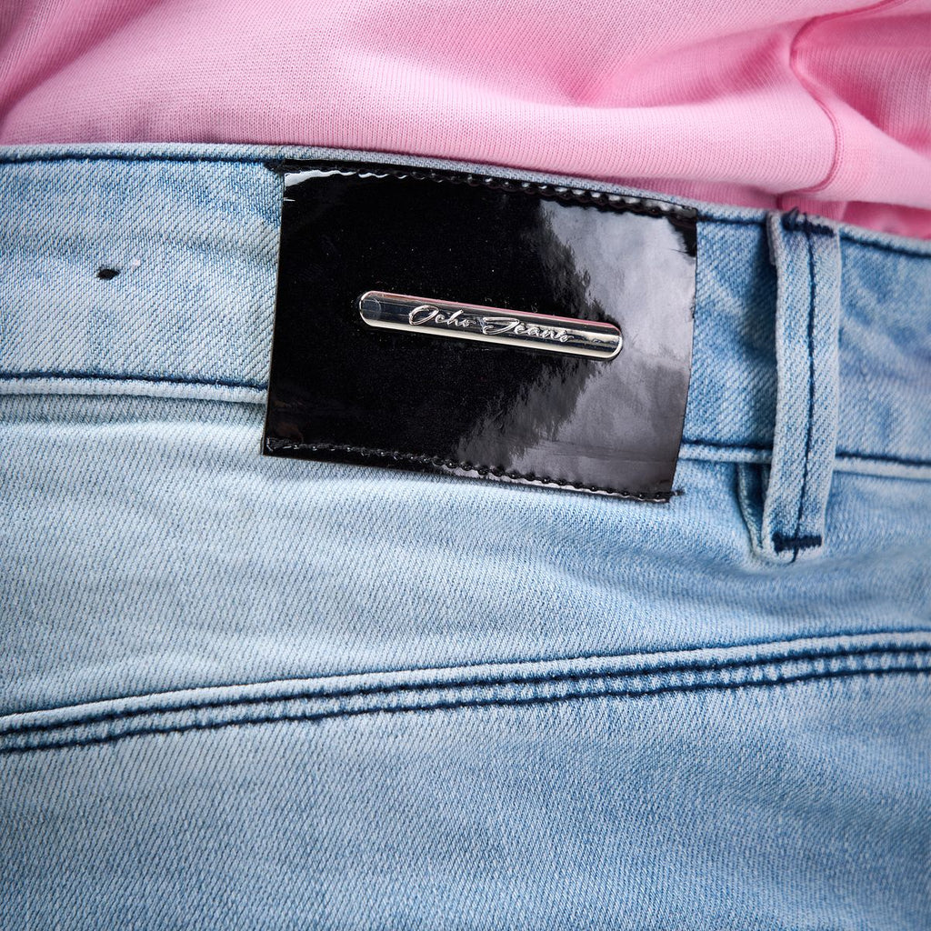 OCHO SHORE light blue jeans, glossy black waistband patch and silver logo detail