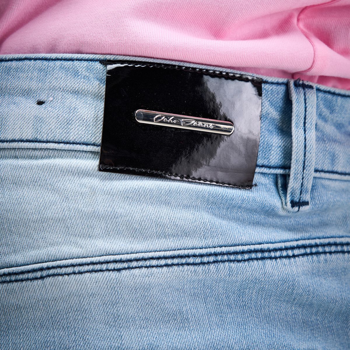 OCHO SHORE light blue jeans, glossy black waistband patch and silver logo detail